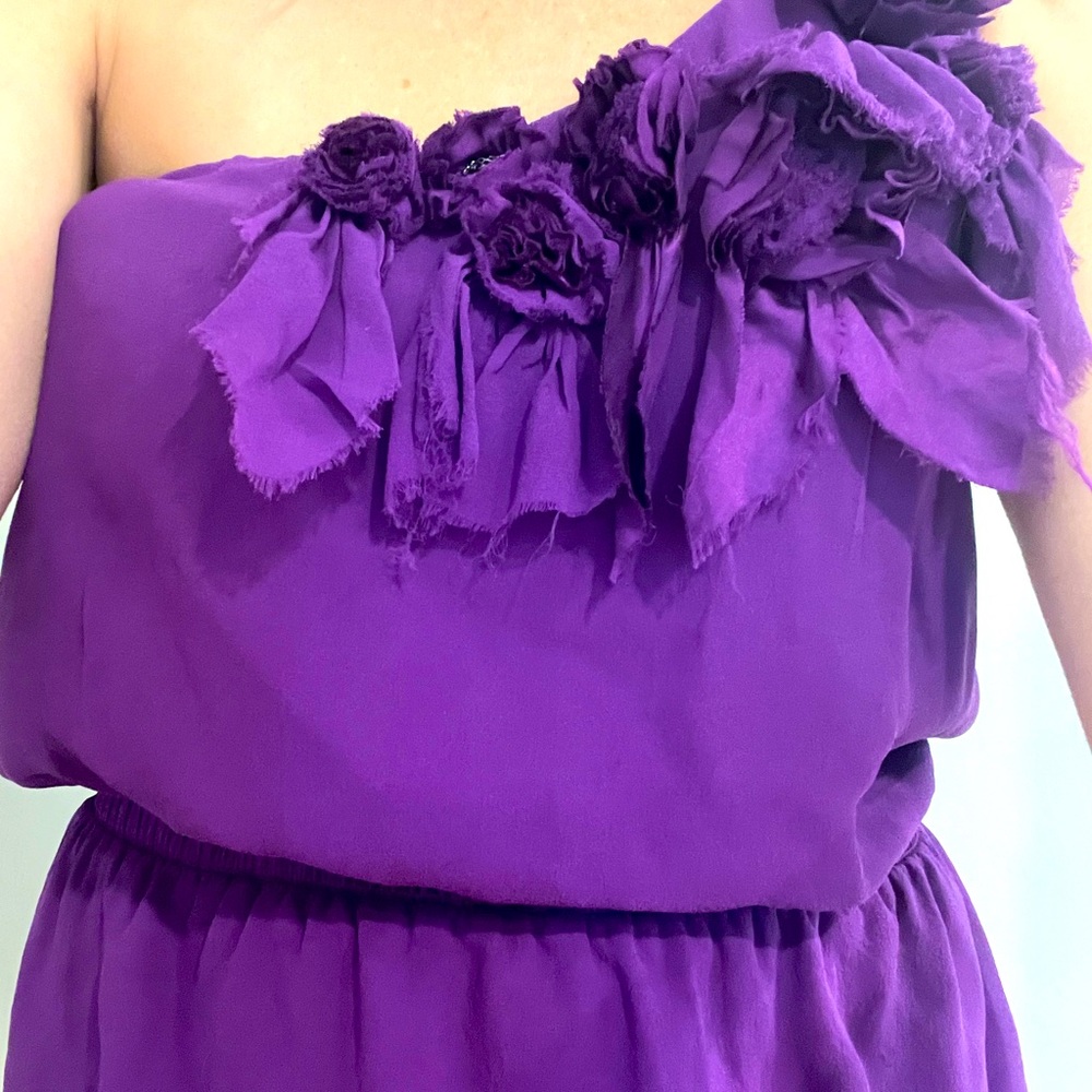 One shoulder Bebe top with beautiful flowers and chain center detail